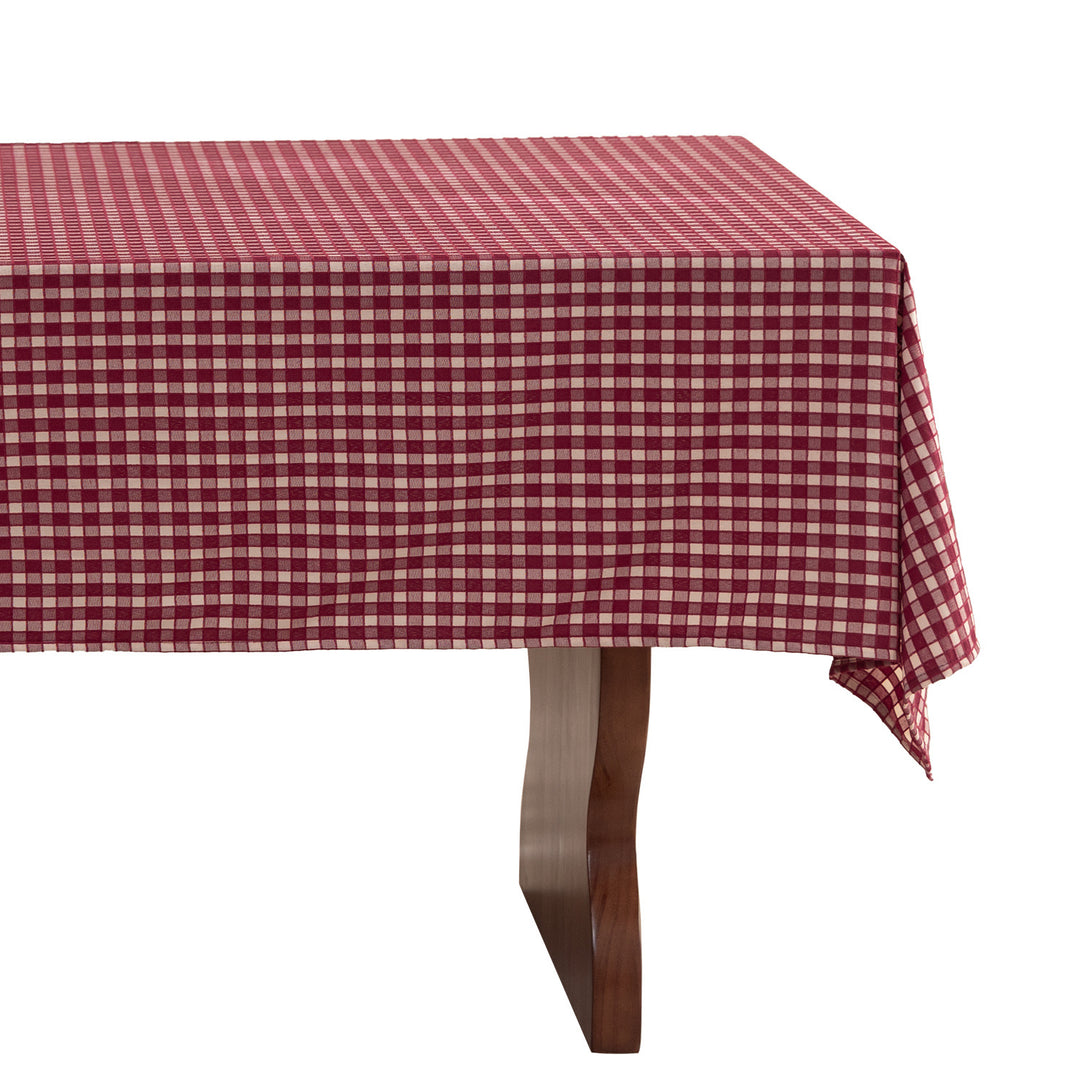 Checked flannel tablecloth with pom-pom tassels and traditional tartan pattern