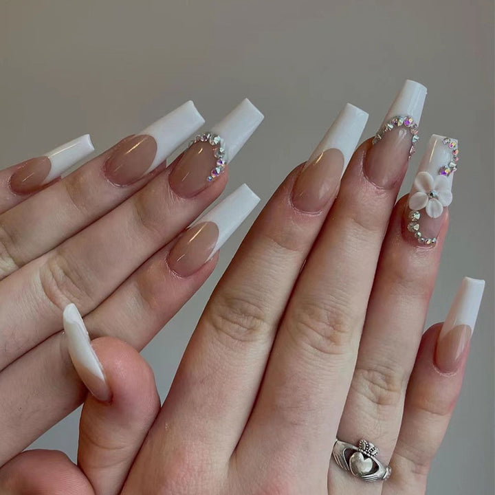 Creative artificial nails with elegant rhinestone and floral accents Stornfield