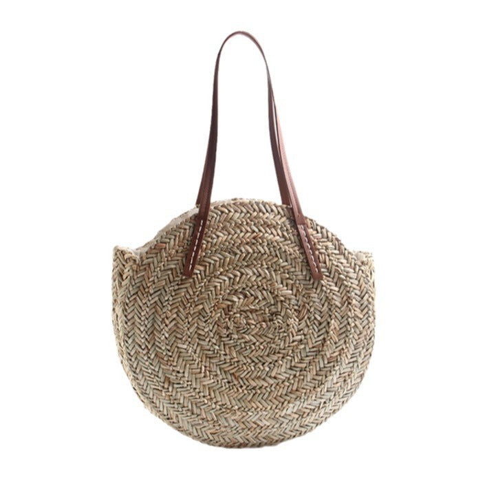 Braided straw beach bag with elegant leather handles Stornfield