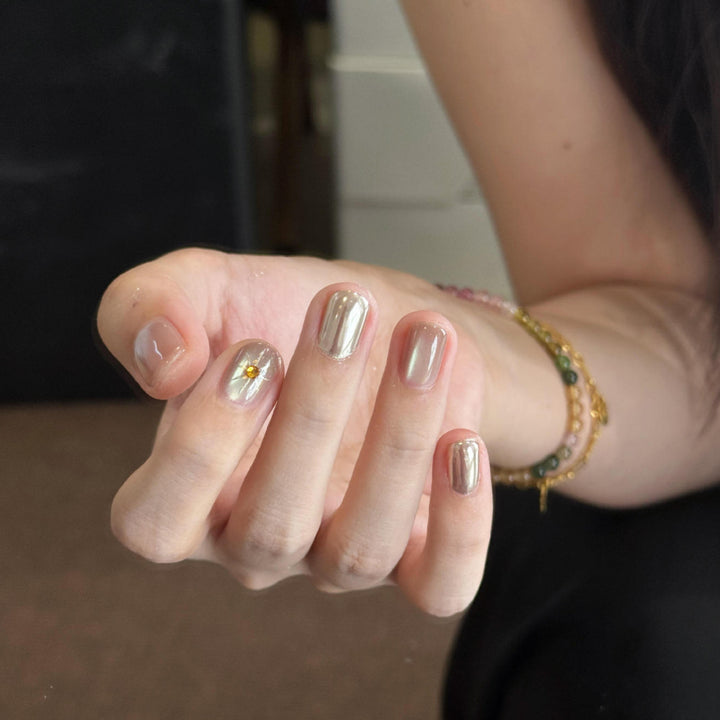 Artificial nails with luxurious metallic finish and sparkling accent Stornfield