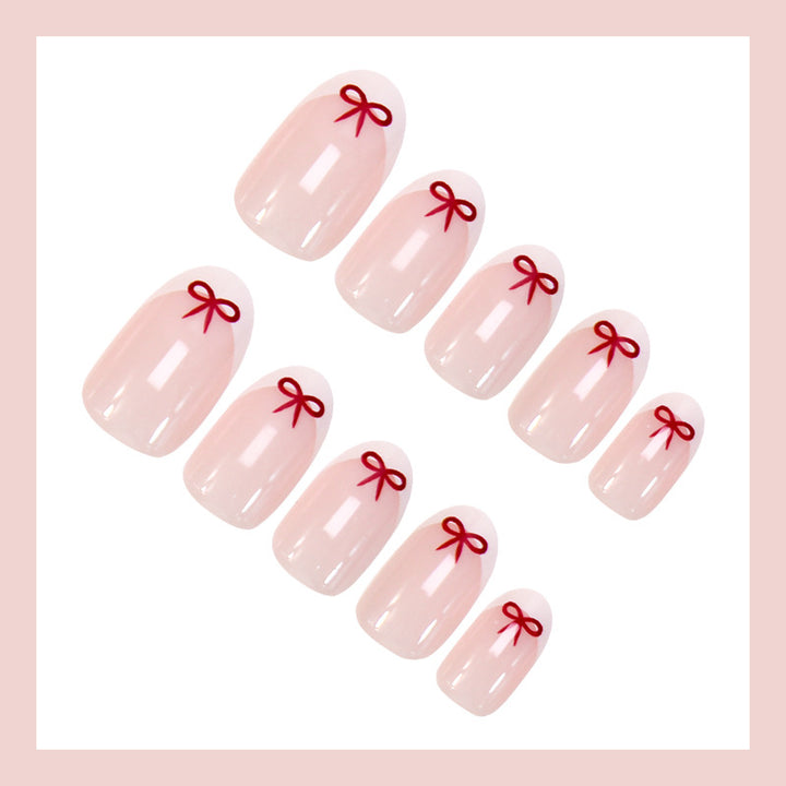 Artificial nail set with romantic bow motifs and French design Stornfield