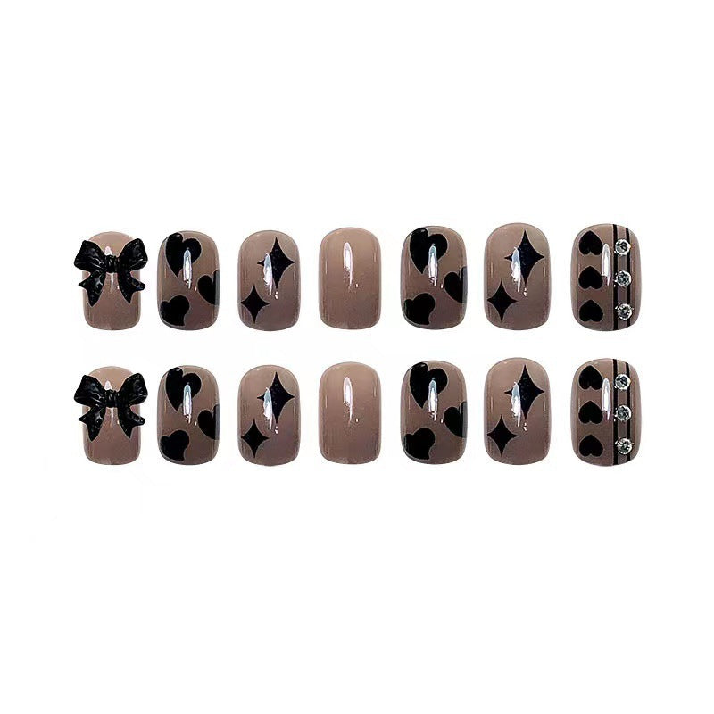 Artificial nails with elegant ribbon and heart designs Stornfield