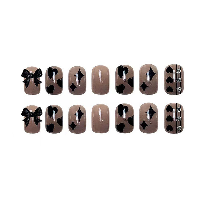 Artificial nails with elegant ribbon and heart designs Stornfield