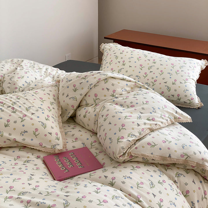 Finely woven cotton percale bedding set with delicate floral print and crocheted lace edge
