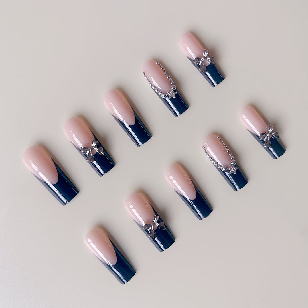 Artificial nail set with glamorous rhinestone accents and elegant 3D designs Stornfield