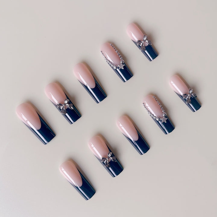 Artificial nail set with glamorous rhinestone accents and elegant 3D designs Stornfield