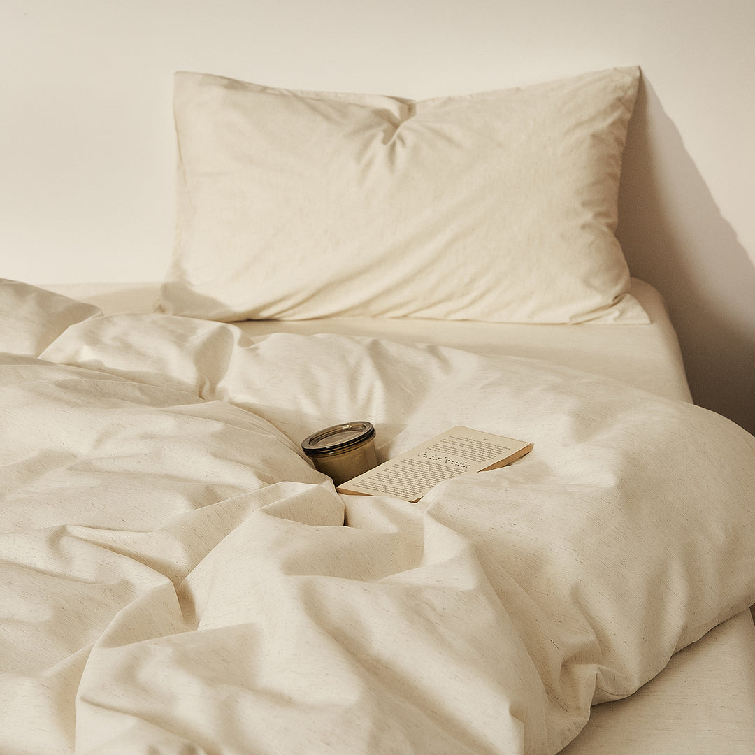 Linen bedding set with fine pinstripes and reversible function