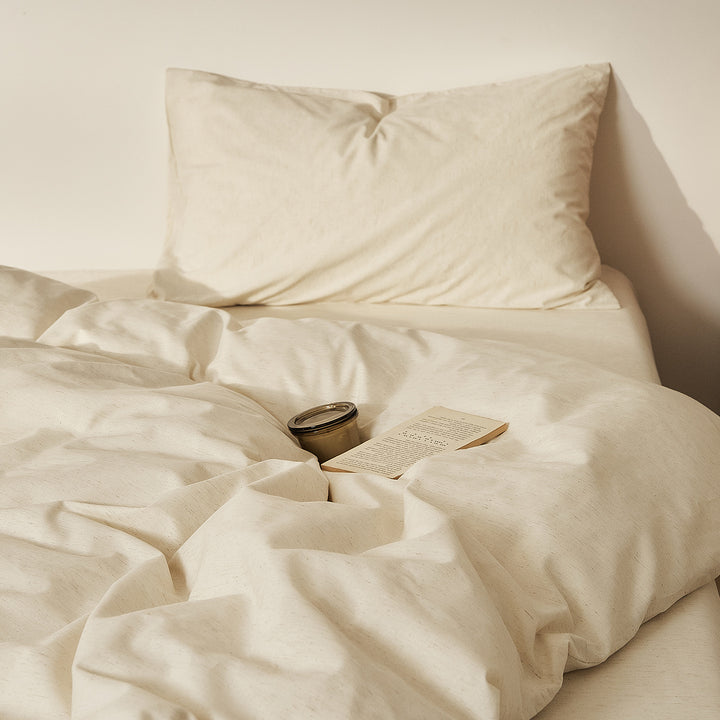 Linen bedding set with fine pinstripes and reversible function
