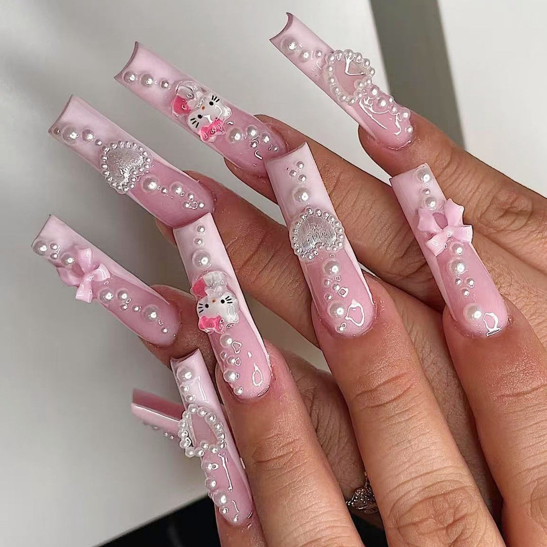 Artificial nail set with playful 3D care and pearl decorations Stornfield