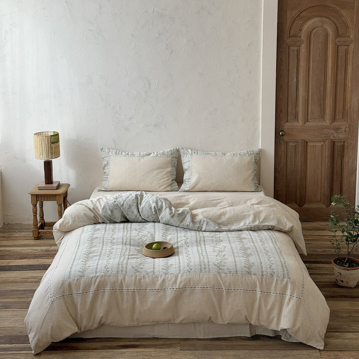 Natural linen-cotton bedding set with embroidered border and vintage pattern