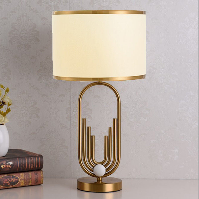 Artistic Table Lamp with Gold and Cream Features