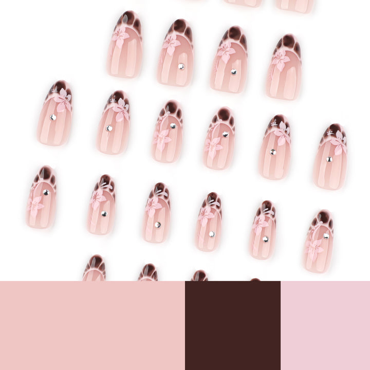 Elegant Artificial Nail Art with Floral Design and Glitter Accents Stornfield