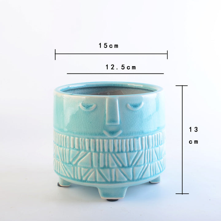 Decorative plant pot with facial features Stornfield