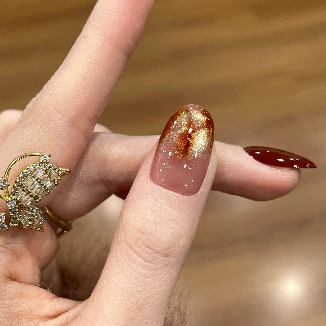 Artificial nail tips with golden accents Stornfield