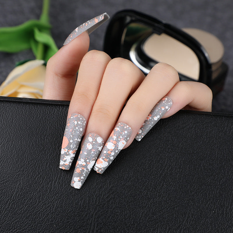 Artistic splatter design artificial nails Stornfield