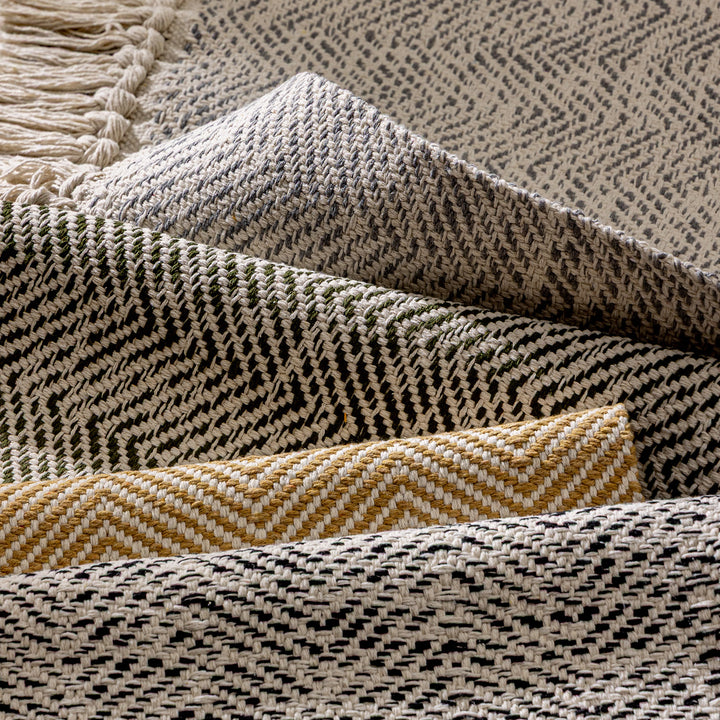 Handwoven runner rug with chevron weave and long fringes