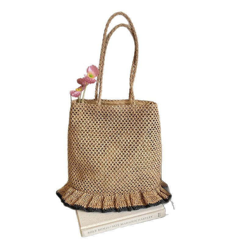 Handcrafted straw bag with fringed hem Stornfield
