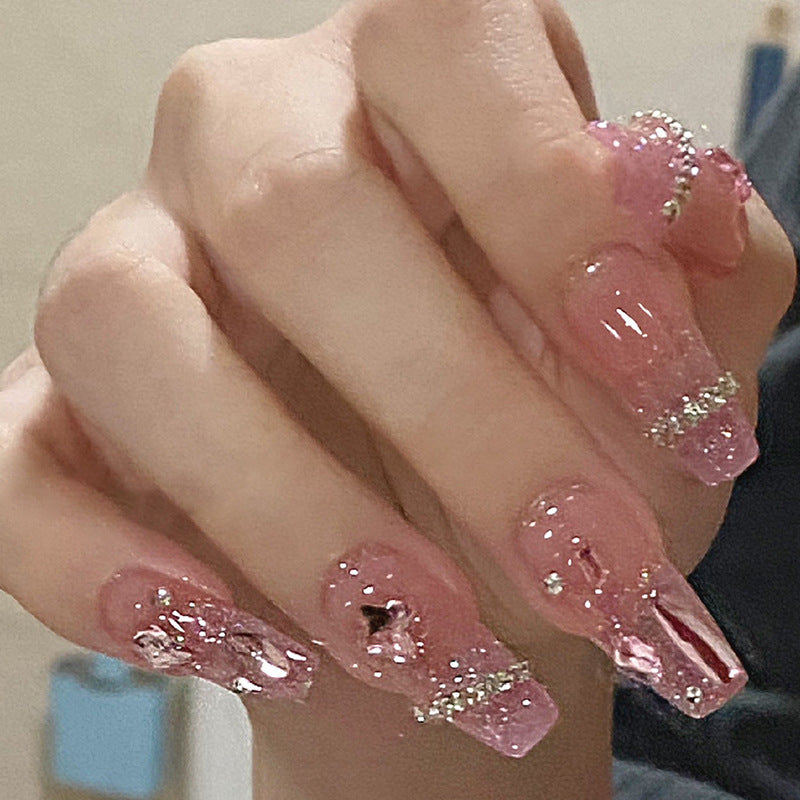 Glamorous artificial nails with delicate flower and glitter effects Stornfield