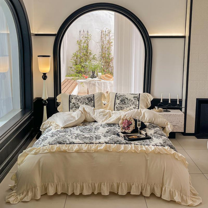Romantic reversible bedding set made of fine cotton satin with ruffled flounces and toile design