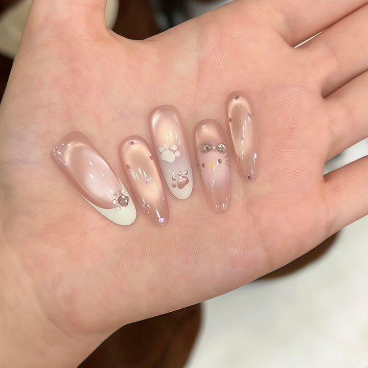 Artificial nail tips with playful penguin and paw print design Stornfield