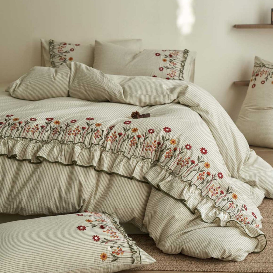 Cotton-linen duvet cover set with fine pinstripe texture, floral embroidery and curved frill