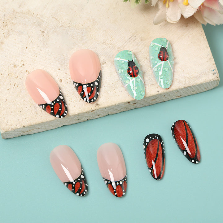 Creative nail art with elaborate butterfly and flower designs Stornfield