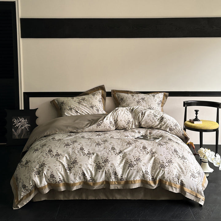 Reversible bedding set made of cotton satin with floral jacquard look and decorative hem