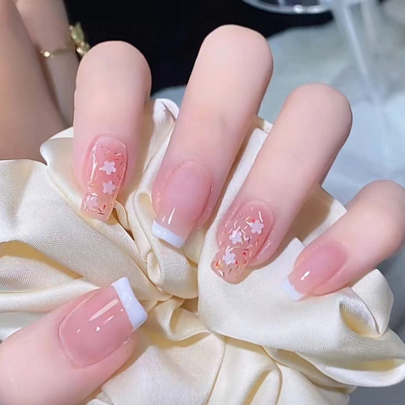 Nail art set with floral decorations and elegant French design Stornfield