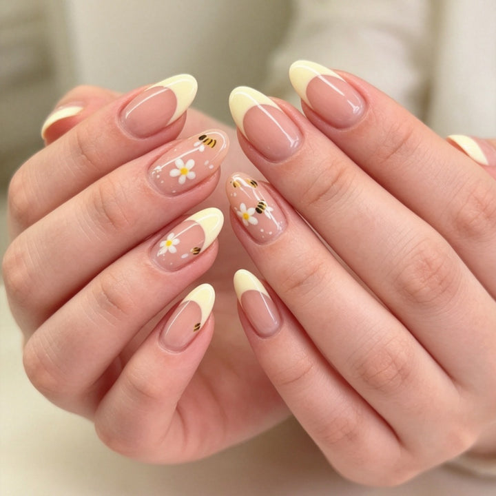 Artificial nails with elegant French tip and floral accents Stornfield