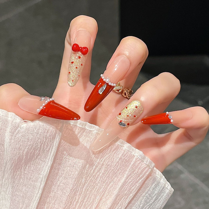 Artistic Stiletto Press-On Nail Art with Glimmering Accents Stornfield