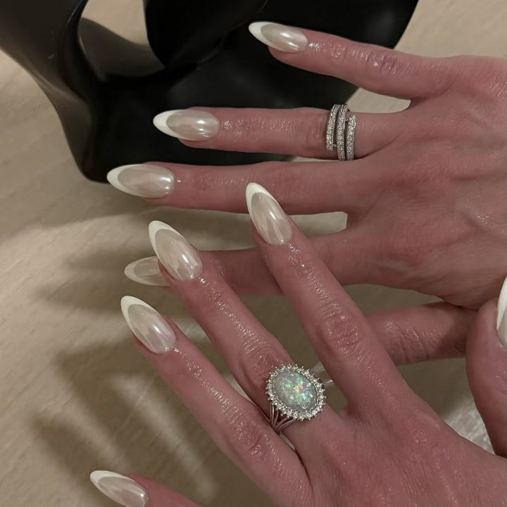 Artistic stiletto nails with elegant French tip embellishments Stornfield