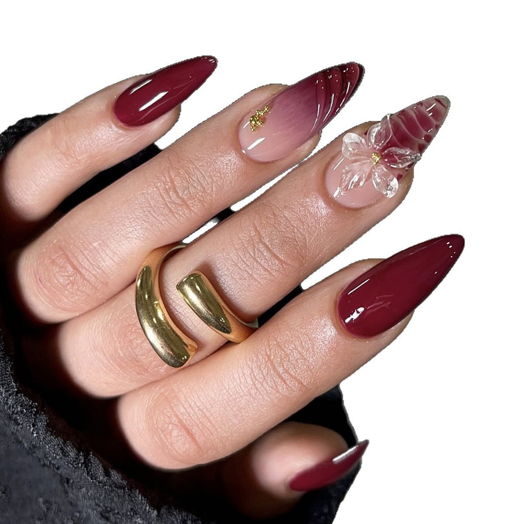 Artificial nail set with modern stiletto design and impressive flower appliqué Stornfield