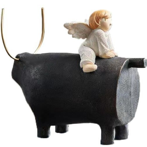Decorative Angel Figurine on Black Bull Sculpture