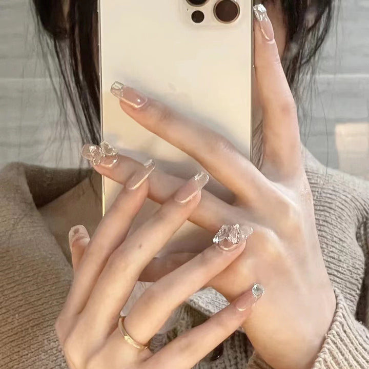 Glamorous artificial nails with delicate rhinestone decorations Stornfield