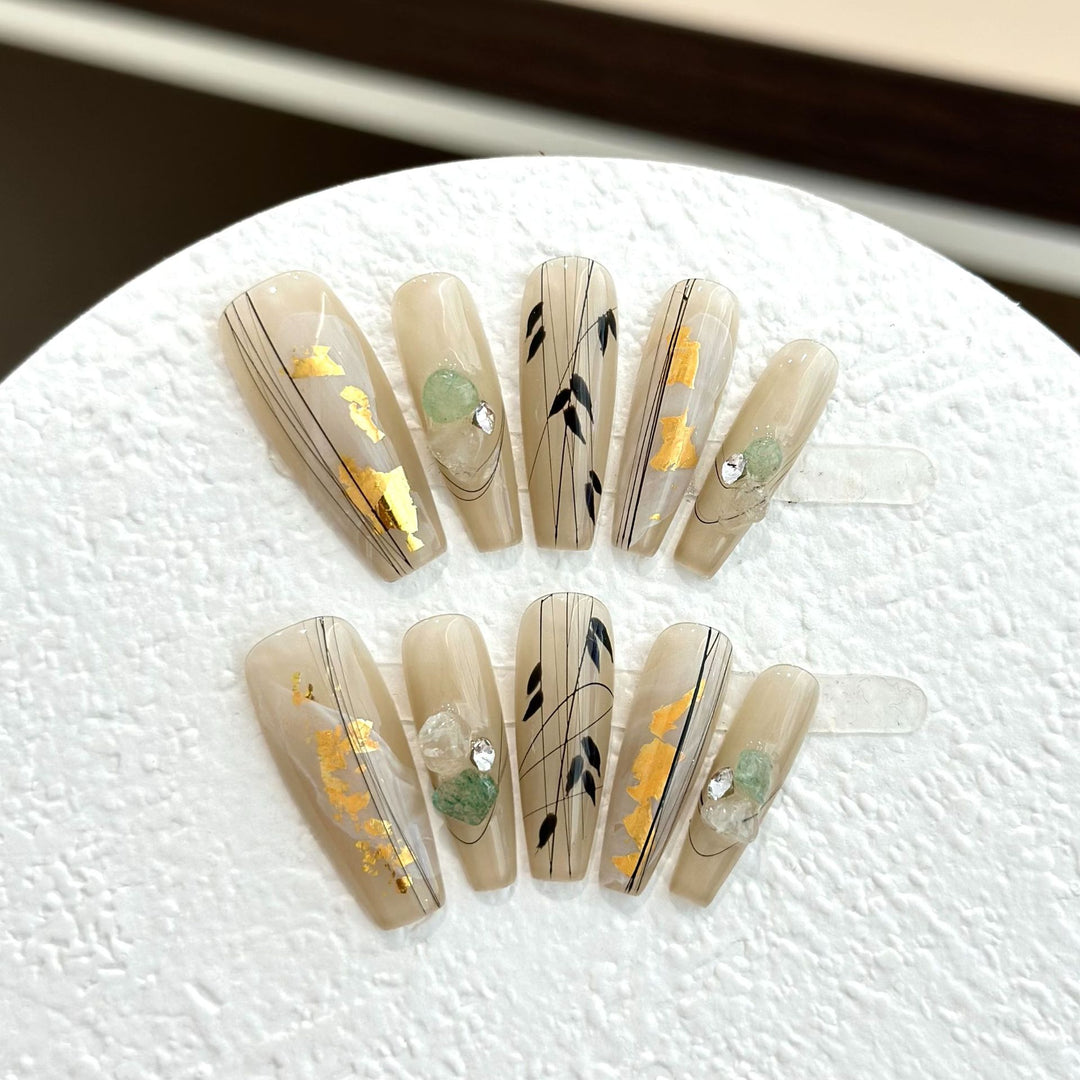 Decorative Press-On Nail Set with Artistic Accents