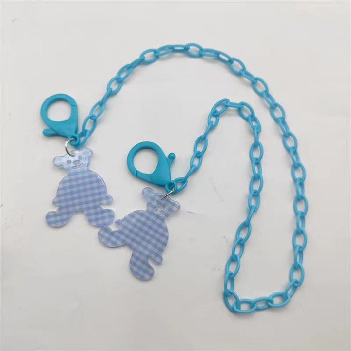 Glasses strap made of transparent resin with rainbow pendant Stornfield