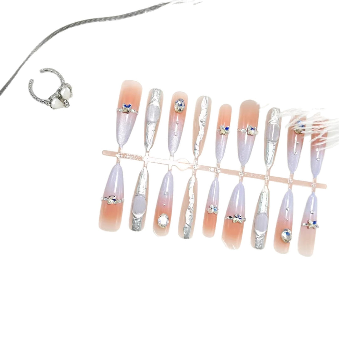 Artificial nails with elegant glitter design and fine 3D decorations Stornfield
