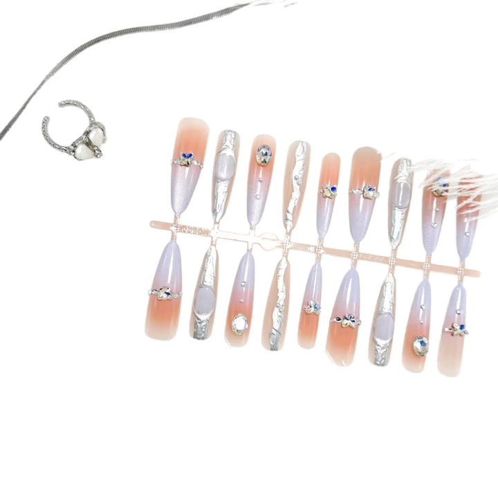 Artificial nails with elegant glitter design and fine 3D decorations Stornfield