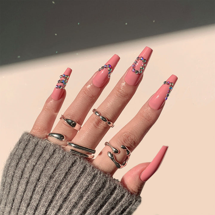 Artificial nail extensions with elegant rhinestone embellishments Stornfield