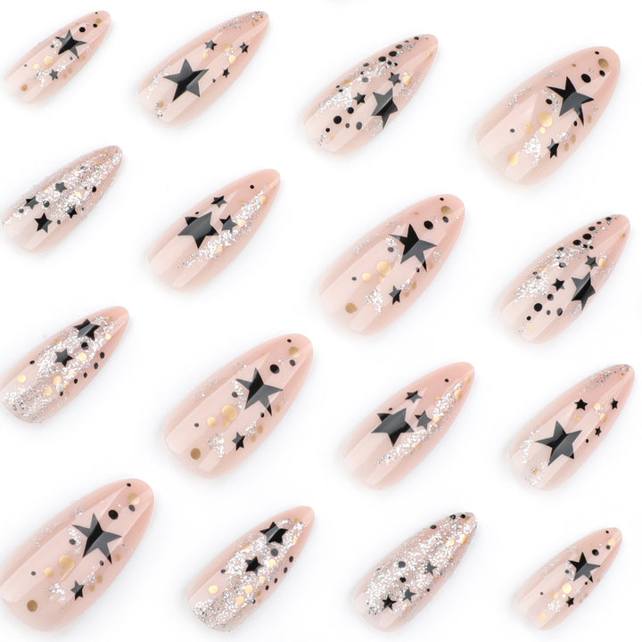 Artistic stiletto nails with glitter and star design Stornfield