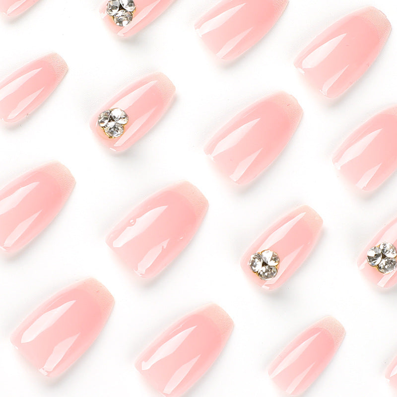 Artful nail extensions with elegant French tip and rhinestone embellishments Stornfield