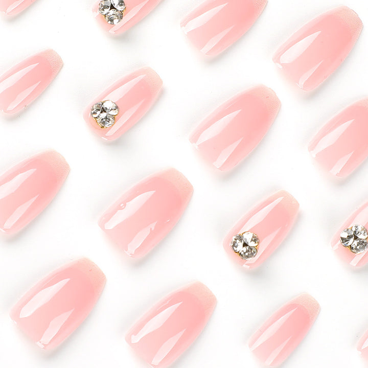 Artful nail extensions with elegant French tip and rhinestone embellishments Stornfield