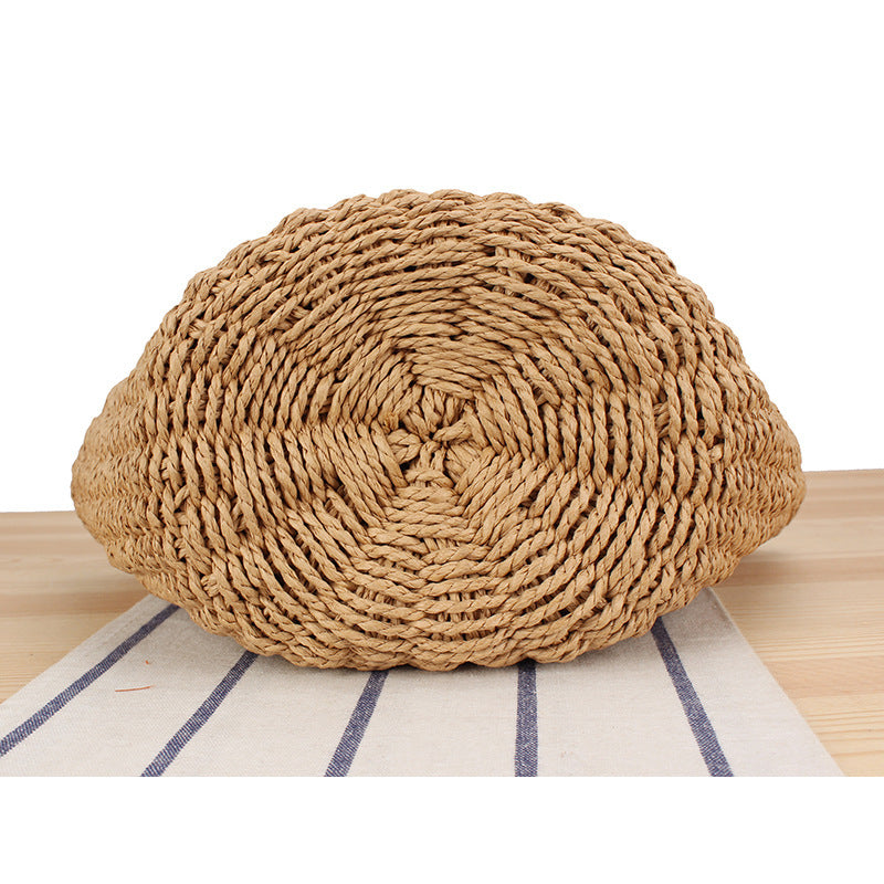 Basket bag made of woven natural material with leather handles Stornfield