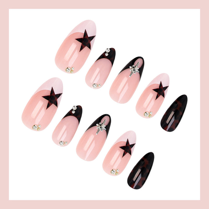 Acrylic nail set with creative star patterns and glitter accents Stornfield