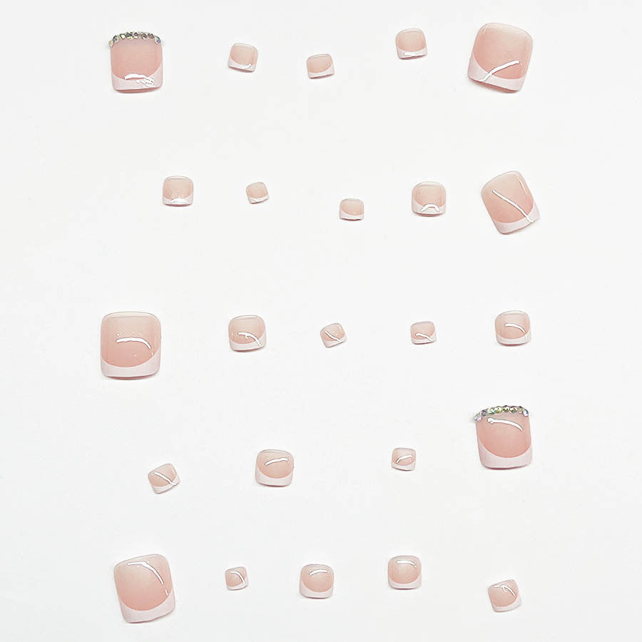 Nail art set with elegant French design and sparkling accents Stornfield