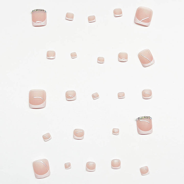 Nail art set with elegant French design and sparkling accents Stornfield