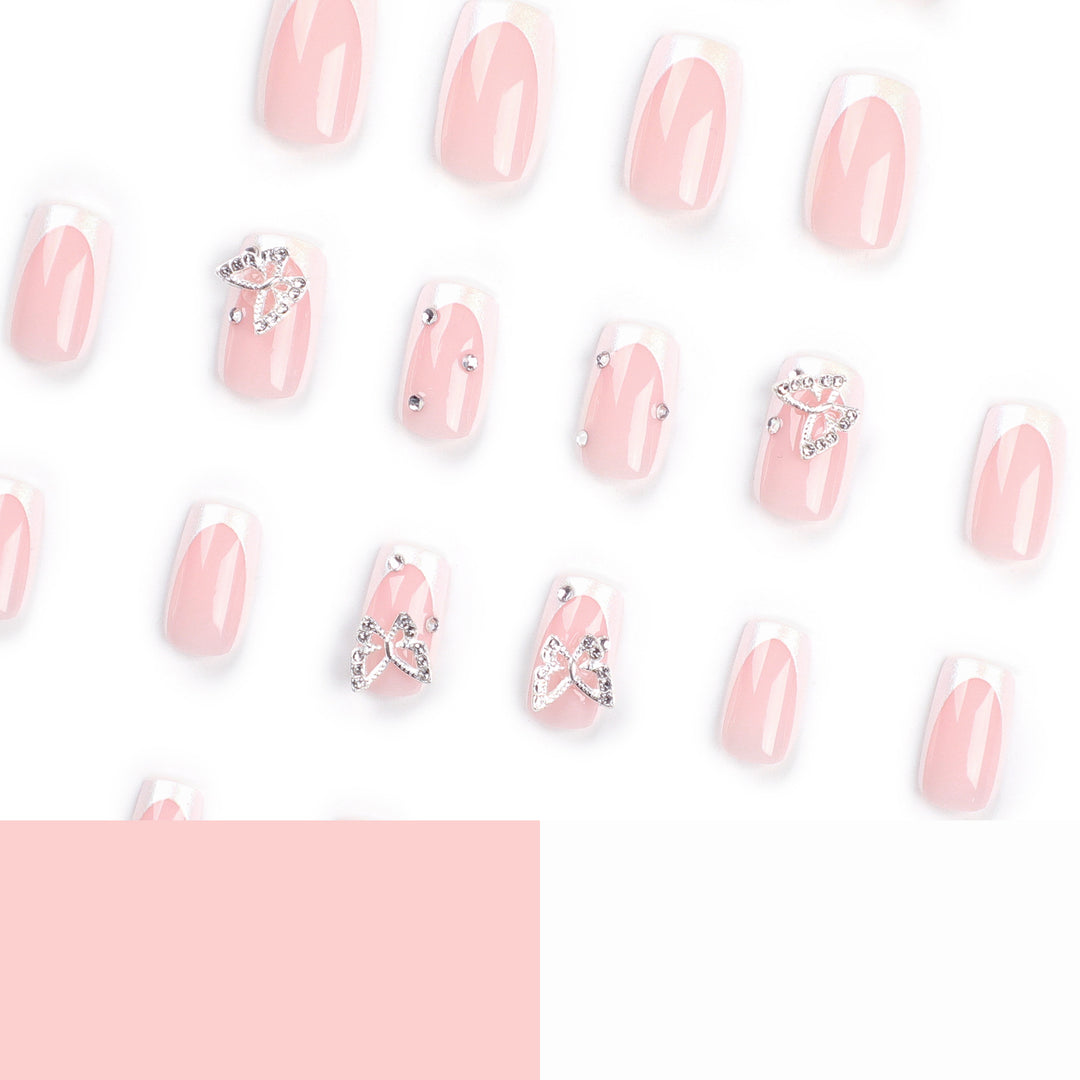 Elegant Nail Art with Glitter and Floral Accents Stornfield