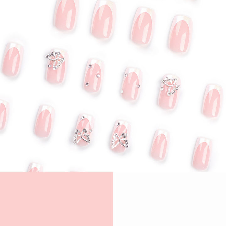 Elegant Nail Art with Glitter and Floral Accents Stornfield