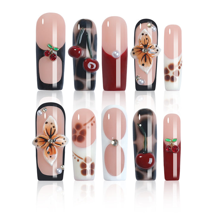 Creative nail art set with floral and fruity accents Stornfield