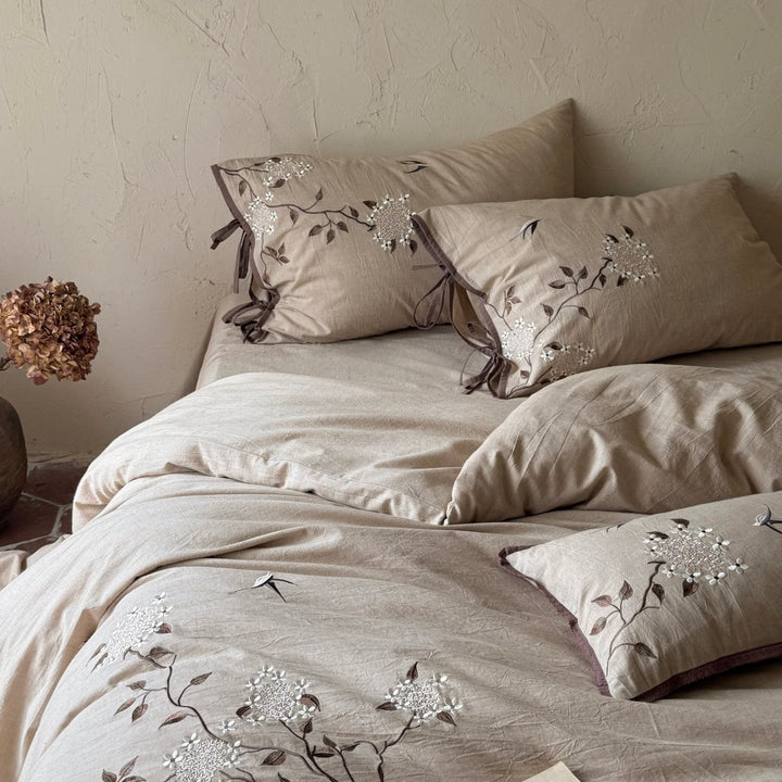 Embroidered bedding set made of linen look with decorative stripes and floral embroidery